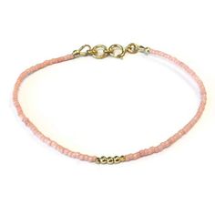 This LIGHT PINK beaded stack bracelet created by Jewelry by CARMAL is made of: light pink glass seed beads, 24K gold vermeil: tiny faceted cube beads, tiny smooth round beads, spring ring clasp closure and findings. This bracelet measures 7 1/2 inches in length. If you need a different size, please feel free to convo us!! :) NOTE: This listing is for 1 LIGHT PINK beaded stack bracelet.  This bracelet is offered in additional colors, see below. BRIGHT YELLOW:  https://www.etsy.com/listing/1064721 Bright Colors Fashion, Etsy Bracelets, Pink Beaded Bracelet, Pink Beaded Bracelets, Stack Bracelet, Blue Beaded Bracelets, Gold Vermeil Jewelry, Rose Pale, Vermeil Jewelry