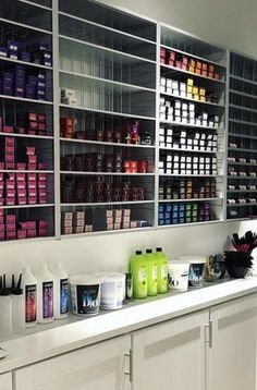 the shelves are filled with many different types of hair and body care products on display