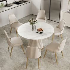 a white table with four chairs around it