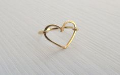 "Romantic heart gold-filled trendy boho ring for women and girls. This perfect ring can be used as a knuckle ring or a regular one, depending on the size you order. This charming heart ring that will fit both women and little girls. This can be a perfect gift for Bat Mitzvah or even sweet 16. Lovely as a friendship ring between mother and daughter. This ring is made from high quality 14K \"Gold Filled\" - unlike \"gold plating\" the gold in gold filled jewelry is mechanically bonded to the base Trendy Heart-shaped Wedding Rings, Handmade Gold Heart Ring For Promise, Elegant Handmade Heart-shaped Rings, Bohemian 14k Gold Ring As A Gift, Bohemian 14k Gold Rings As Gift, Simple Open Heart Wedding Jewelry, Elegant Adjustable Heart-shaped Stackable Rings, Simple Gold Heart Ring As Gift, Delicate Gold Stackable Rings For Valentine's Day