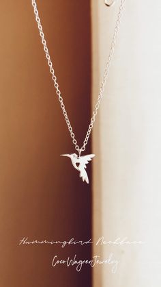 *Ready-to-Ship jewelry will ship within 1-2 business days.Looking for a great gift for someone who loves nature? Check out this lovely hummingbird charm on a durable yet lightweight chain. It's sure to delight any nature enthusiast!Hummingbirds represent lightness and happiness. People who have hummingbirds as their totem are believed to possess playful, adaptable, and negativity-resistant qualities. They also serve as great reminders to embrace life to the fullest and cherish its simple pleasur Gold Plated Gemstone Necklace Hummingbird, Silver Bird Necklace, Hummingbird Jewelry, Hummingbird Necklace, Hummingbird Pendant, Extraordinary Jewelry, Silver Bird, Gift Girlfriend, Jewelry Accessories Ideas