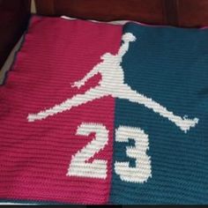 a crocheted blanket with the number 23 on it