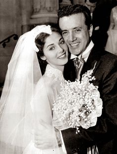 a bride and groom posing for a photo