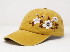 Flower is 100% hand embroidered on a 100% cotton wash baseball cap. Hat is one size fits all with adjustable back strap. Unique cap, one of a kind! I am also open for customization. If you want the item in different colors, please message me, it will take additional 2-3 days of handling time. Free first class shipping, upgradable priority mail service. 30 days return policy, feel confident at your purchase! Vintage Baseball Cap With Curved Visor For Spring, Yellow Baseball Cap For Spring, Yellow Snapback Baseball Cap For Spring, Yellow Adjustable Dad Hat For Spring, Yellow Snapback Dad Hat For Spring, Yellow Snapback Hat For Spring, Adjustable Fitted Hat With Curved Bill For Spring, Adjustable Curved Bill Fitted Hat For Spring, Embroidered Adjustable Snapback Hat For Spring