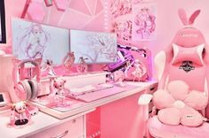 a pink room with many items on the desk