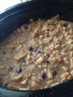 a crock pot filled with beans and tofu