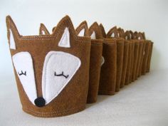 a set of six little cups that have been made to look like foxes