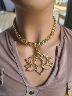 This is a beautiful 24k Gold Filled Layered Necklace with oversized lotus flower pendant! This stunning necklace is the perfect zen statement protection gift for her, featuring a delicate and intricate design that is both elegant and meaningful. Crafted using high-quality gold filled chain and pendants that contain no lead, nickel or cadmium. The lotus flower grows from mud and returns to the murky water each evening, but opens into a beautiful bloom at the break of day, a symbol of strength, resilience, and rebirth. This makes this necklace a perfect gift for anyone looking to embrace new beginnings or celebrate personal growth. 💗NOTE💗 To prolong the life of your gold plated and/or vacuum plated jewelry and keep the colour and shine, avoid direct contact with perfume, water and lotions. Spiritual Lotus Flower Necklace For Meditation, Murky Water, Lotus Flower Pendant, Break Of Day, Lotus Necklace, Gold Lotus, Zen Buddhism, Protection Necklace, Stunning Necklace