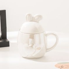 Product ID: JW5021 
 Material: Ceramic 
 Height: 13cm 
 Capacity: 300ml 
 Package list: 1 mug, in choice of color Bunny Mug, Ceramic Bunny, Adorable Bunny, Blue Bowl, Garden Wall Decor, Journal Stationery, Stationery Pens, Ceramic Flowers, Fine Porcelain