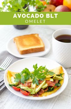 an omelet on a plate next to a bowl of fruit and a cup of coffee