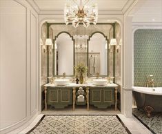 a bathroom with two sinks and a bathtub in the middle, surrounded by chandeliers