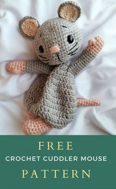 a crocheted mouse sitting on top of a white bed with the text free crochet cuddler mouse pattern