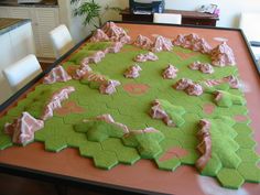 a table that has some green and pink decorations on it