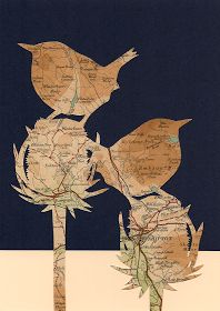 two birds sitting on top of a tree branch in the middle of a map print