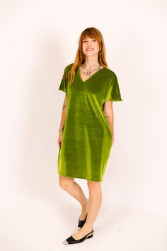 Introducing the Velvet V-Neck Dress – where style and comfort meets versatility! This softly lined dress makes the garment comfortable and easy to wear. It has reversible pockets perfect for holding all your things. The oversize fit and dolman sleeve make this easy to dress up or down. Pair it with some sneakers or put it with a heel, either way you are sure to turn heads! Whether you're looking to make a statement at a party, add a touch of glam to your everyday life, or simply spread a little Relaxed Fit V-neck Midi Dress For Loungewear, Green V-neck Midi Dress With Relaxed Fit, Green V-neck Relaxed Fit Midi Dress, Green Relaxed Fit V-neck Midi Dress, Oversized V-neck Midi Dress, Relaxed Fit V-neck Loungewear Dress, Oversized Green V-neck Dress, Olive Velvet, The Velvet