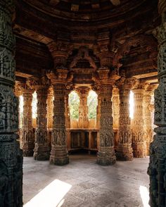 the inside of an ornate building with columns and arches