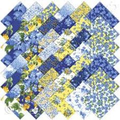 a blue and yellow patchwork quilt with flowers on the front, in different colors