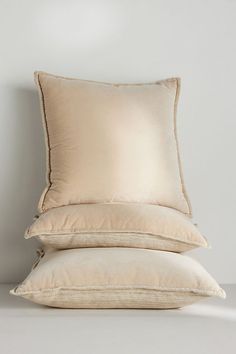 two pillows stacked on top of each other