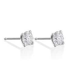 Our Martina earrings are a pair of glamorous 1.04ct diamond earrings. There's nothing more classic to wear than our Martina diamond earrings. They are iconic, classic and beautiful. With their perfect cut and impeccable shape, they are every woman's must-haves. A 5mm White diamond held by 4 white gold prongs and closes with a butterfly back. The earrings are sold as singles The Martina can be worn to top off an exquisite evening look. They are both classic and stunning, and add the perfect sparkle for a polished, feminine style. They can be customized with any stones of your choice. All features can be customized! please contact us if you wish to make changes, we love making custom designs. All of our jewelry is carefully handmade in our atelier *HC diamond are all conflict-free diamonds T White Gold Earrings, Nothing More, A Butterfly, Conflict Free Diamonds, Feminine Style, Every Woman, White Diamond, Diamond White, Gold Earrings