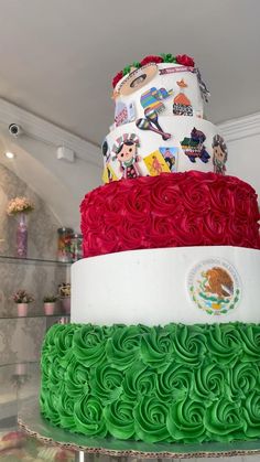 a large multi layer cake decorated with red, white and green icing