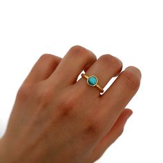 Our ring is adjustable, with natural stone. It is perfect for everyday or any special occasion. All our jewelry can get wet. It is very striking due to its beautiful natural stone and its minimalist style. It is perfect for giving as a ring that can be adjusted to all fingers! - MATERIAL: * 18 Kt Gold Plated - NATURAL STONE: * Turquoise colored stone - STONE SIZE: * 6mm All our jewelry is handmade with love, designed and created by us. We are lovers of jewelry and fashion, that's why we put so m Adjustable Everyday Open Birthstone Ring, Adjustable Everyday Birthstone Ring, Adjustable Stackable Oval Midi Rings, Handmade Minimalist Adjustable Birthstone Ring, Handmade Adjustable Minimalist Birthstone Ring, Adjustable Bezel Set Rings For Everyday, Stackable Oval Midi Rings As Gift, Stackable Oval Midi Rings For Gift, Adjustable Birthstone Midi Rings For Everyday Wear