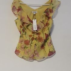 New Bb Dakota Sleeveless Yellow With Floral Pattern Of Pink & Rose Colored Flowers. Size Small Has Original Tags Fully-Lined Cloth Covered Buttons With Same Fabric Armpit To Armpit Measures Approx. 18" Beautiful Flowery Blouse! Yellow Floral Print Tank Top For Spring, Summer Yellow Floral Print Tank Top, Sleeveless Summer Top With Button Closure, Yellow V-neck Top With Button Closure, Fitted Tank Summer Blouse, Fitted Tank Blouse For Summer, Yellow Summer Blouse With Button Closure, Chic Yellow Tops With Button Closure, Yellow Sleeveless Spring Blouse