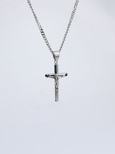 The Crucifix serves as the ultimate reminder of the sacrifice and strength in what Christ has done for us. Designed with intense care and detail, our Stainless Steel Crucifix and chain serve as a powerful and durable statement of where we derive our strength from and who we put our faith in, Jesus Christ. Features: Water, sweat, and heat resistant 23.6 in (60 cm) Chain length 22 x 40 mm Pendant Size One size fits most Forged from High Grade Stainless Steel 90 Day Warranty HolStrength - Premium C Silver Crucifix Necklace, Crucifix Cross Necklace With Curb Chain For Gifts, Crucifix Cross Necklace With Curb Chain As Gift, Christian Gym, Streetwear Fall, Crucifix Necklace, Leggings Hoodie, Wristbands, Gold Pendant Necklace