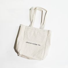 Carry your love for the shore wherever you go.This sturdy, gusseted tote is perfect for any errand or adventure — just the right size for your essentials without being too bulky.Details• 14"H x 10.5"W x 5"D• 12 oz cotton canvas• Side gussets• 23-inch handlesScreen printed in Rhode Island. Soap Company, Rhode Island, Cotton Canvas, Screen Printing, Reusable Tote Bags, Product Launch, United States, Tote Bag, Canvas