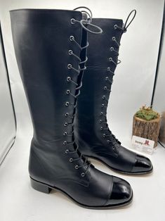 Fitted Leather Knee-high Combat Boots, Fitted Knee-high Leather Combat Boots, Fitted Leather Martin Boots With Round Toe, Fitted Cap Toe Boots With Reinforced Heel, Fitted Leather Moto Boots With Almond Toe, Western Knee-high Leather Martin Boots, Western Leather Knee-high Martin Boots, Fitted Leather Knee-high Boots With Closed Toe, Fitted Leather Knee-high Martin Boots