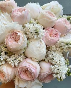 a bouquet of pink and white flowers