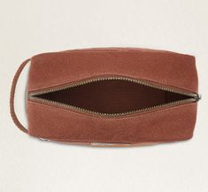 a brown case with zippers on the inside