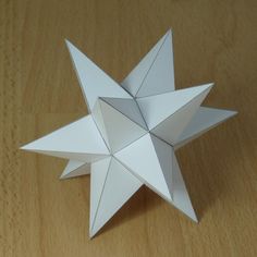 an origami star on a wooden table