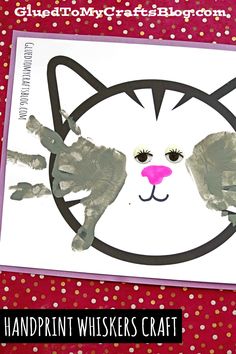 a handprint cat is shown on the front of a card