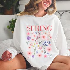 Spring Sweater, Floral Sweatshirt, Pink Flowers Sweater, Spring Vibes Sweatshirt Comfy sweater alert! This is a thick, warm and cozy crewneck, lined with warm fleece. This sweatshirt is extremely soft on your skin and very comfortable to wear.  ❤ SIZING  This style is UNISEX. Please, make sure to check our sizing charts included in product pictures, and compare measurements with one of your own sweaters before purchasing. ❤ ABOUT our sweatshirts + Crew neck  + Made of 50/50 cotton and polyester air jet yarn + Designed with love in Canada, printed and shipped from the US ❤ CARE INSTRUCTIONS To maintain the longevity of the colors on your design, wash with like colors, in cold water, on gentle cycle. Do not iron. Tumble dry on low or air dry. Do not use and iron directly on design. ❤ SHIPPIN Cheap Pink Spring Sweatshirt, Floral Sweatshirt, Flower Sweater, Comfy Sweater, Floral Sweater, Spring Sweater, Sweatshirt Vintage, Spring Vibes, Comfy Sweaters