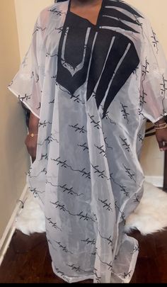 Our Signature Kaftan is a beautiful combination of black and white made from organza and embroidery. The lightweight material ensures you stay comfortable while the elegant appeal adds an elegant touch to any outfit. Let this stylish piece be the star of your wardrobe. Organza Kaftan, Embroidery Kaftan, Embroidered Organza, The Star, Quality Fabric, Must Haves, Things To Sell, Embroidery, Black And White