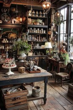 an old fashioned kitchen with lots of pots and pans on the shelves in it