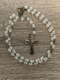 "Vintage Catamore Sterling Silver Crystal Bead Rosary. It is marked \"Catamore\" and \"Sterling\". The cross measures 1 3/8 by 2 inches. This is a beautiful rosary that would make an excellent gift or additional to your own collection. In very good condition; does have some tarnishing due to age on the crucifix/cross." 8mm Bead Crucifix For First Communion, 8mm Bead Crucifix Jewelry For First Communion, Rosary With Faceted Beads And Crucifix, First Communion Spiritual Rosary With Crucifix, Spiritual Rosary With Crucifix For First Communion, Spiritual Crucifix Rosary For First Communion, Spiritual Cross Rosary With Faceted Beads, Beaded Cross Rosary For First Communion, Beautiful Rosary