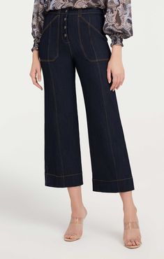 Indulge in the timeless classic, the Benji Pant. These wide-leg cropped denim jeans feature utilitarian patch pockets for a look that yours must-have. Essential for any wardrobe! Details Button flyFabric: Indigo DenimHigh risePatch pocket detail Cropped Content and Care 77% Cotton 21% Polyester 2% ElastaneDry Clean OnlyImported Measurements 26in/66.04cm, inseamMeasurements from size 4 High Rise Denim Blue Pants With Seam Detailing, Denim Cropped Leg Pants With Seam Detailing, Luxury Cropped Denim Blue Pants, Mid-rise Denim Blue Bottoms With Button Closure, Mid-rise Denim Blue Pants With Button Closure, Cinq A Sept, Cuffed Jeans, Indigo Colour, Indigo Fabric