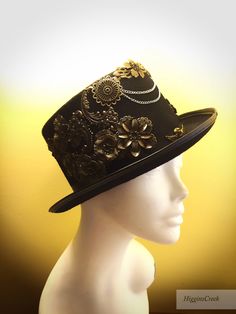 "Neo-Victorian top hat combining a vintage Victorian style with subtle eccentricity of mechanical aesthetic of steampunk, this unisex top hat is fitted with a variety of Victorian vintage baubles and fantastical cogs & gear ornaments on a formed Felt hat with with Ribbon Band. Choosing the custom theme Hat option? Whether you are a high-society aristocrat, a brilliant Steam engineer or a greasy Steam-machine mechanic, your customized hat will work wonderfully with almost any ensemble. S I Z Steampunk Costume Top Hat, Vintage High Crown Top Hat For Costume Party, Vintage Top Hat For Costume Party, Vintage Top Hat With Curved Brim For Costume Party, Vintage Curved Brim Top Hat For Costume Party, Steampunk Top Hat With Short Brim For Costume Party, Steampunk Costume Hat With Curved Brim, Steampunk High Crown Costume Hat, Steampunk Brimmed Top Hat For Costume Party