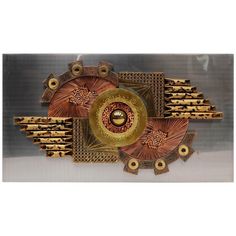 an intricately designed metal object with gold accents