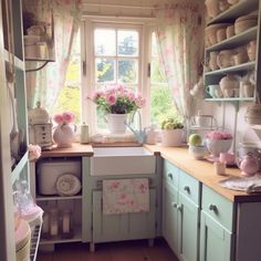 a kitchen filled with lots of counter top space next to a stove top oven under a window