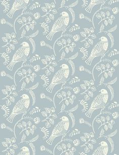 a blue and white wallpaper with birds on it