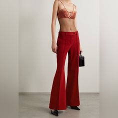 Acne Studios' Tailored From Red Twill That's Blended With Wool And A Hint Of Stretch For A Non-Restrictive Fit. They're Cut To Sit On The Waist And Have Flared Legs Traced With Elongating Center Seams Before Falling To Cuffed Hems. Elegant Red Flare Bottoms, Red Fitted Pants For Evening, Red Wide Leg Bottoms For Evening, Evening Fitted Red Pants, Tailored Red Wide Leg Pants, Tailored Red Wide-leg Pants, Red High Waist Evening Pants, Red High Waist Pants For Evening, High Waist Red Pants For Evening