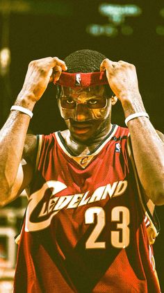 a basketball player with his face painted in the colors of cleveland and number 23 on his jersey