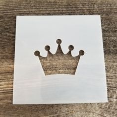 a piece of paper with a cutout of a crown on it