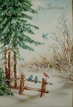 a christmas card with two birds sitting on a fence