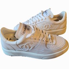 Chanel White Leather Classic Cc Low-Top Lace-Up Sneakers Style # G45079 Impossible-To-Find, Most Coveted Classic Chanel Sneaker Style Size Marked: 36 -- Runs A Bit Small/ Narrow, Fits Like Us 5.5 (This G45079 Style Runs A Bit Smaller/Narrower Compared To Other Chanel Sneaker Styles....So Best To Size Up) Brand New, Never Worn No Box/ Dust Bag Designer White Sneakers With Embossed Logo, Designer Low-top Sneakers With Boost Midsole, Designer White Sneakers With Perforations, White Luxury Low-top Sneakers, Designer White Custom Sneakers With Embossed Logo, Designer White Sneakers With Laces, Luxury White Custom Sneakers With Embossed Logo, Luxury Custom White Sneakers With Embossed Logo, Designer White Lace-up Sneakers