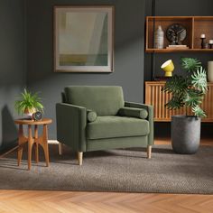 a living room with a green chair and potted plants on the floor next to it