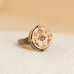 The Psyche ring is made of nickel-free bronze and available in two color versions: antique bronze and antique silver. It is composed of an 18mm bezel with a medallion in solid olive, oak and/or wenge wood treated with non-toxic products, to be inlaid or engraved by choosing from the 20 symbols of the collection. Adjustable size. Radika's design is imperfect in its craftsmanship, every single irregularity is to be considered a quality to guarantee the uniqueness and authenticity of the craftsmans Spiritual Ring, Jewelry Recycled, Symbol Jewelry, Toxic Products, Lotus Ring, Wenge Wood, Natural Jewelry, Symbolic Jewelry, Yoga Gifts