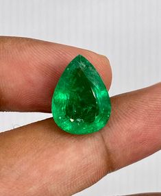 This is an exuberant natural vivid green emerald born in Zambia, Pears cut. The gemstone possesses numerous enticing qualities, of the which are the following; a medium-light lustrous green color and VS clarity is found in this gemstone. This magnificent gemstone would be ideally set in a ring, Pendant or i even recommend it for brooch. Message us for custom creations.  Stone: Zambian Emerald Shape: pears Cut  Luster: Excellent Dimensions: Excellent  Color: Medium vivid Green Saturation: Moderat Green Pear-shaped Emerald Gemstone Ring, Green Pear-shaped Emerald Ring, Gia Certified Pear-shaped Green Emerald Ring, Green Emerald Cut Gemstones For May Birthstone, Emerald Cut Green Gemstones For May Birthstone, Gia Certified Oval Green Gemstones, Classic Pear-shaped Green Emerald Ring, Elegant Untreated Green Emerald Ring, Gia Certified Green Gemstones Fine Jewelry